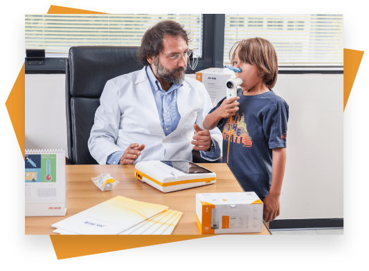 A pediatric patient using a spirometer while a doctor observes.